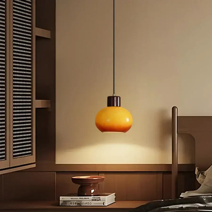 DecorBites amber glass led pendant light with warm amber glass shade and black metal fixture for rustic interiors