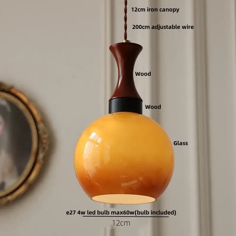 DecorBites amber glass led pendant light with warm amber gradient glass and dark wood neck for rustic interiors