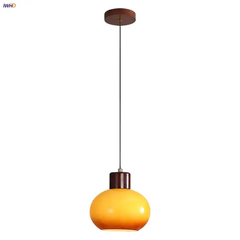 Warm amber glass pendant light with dark wood ceiling mount and metal chain by decorbites amber glass led lighting