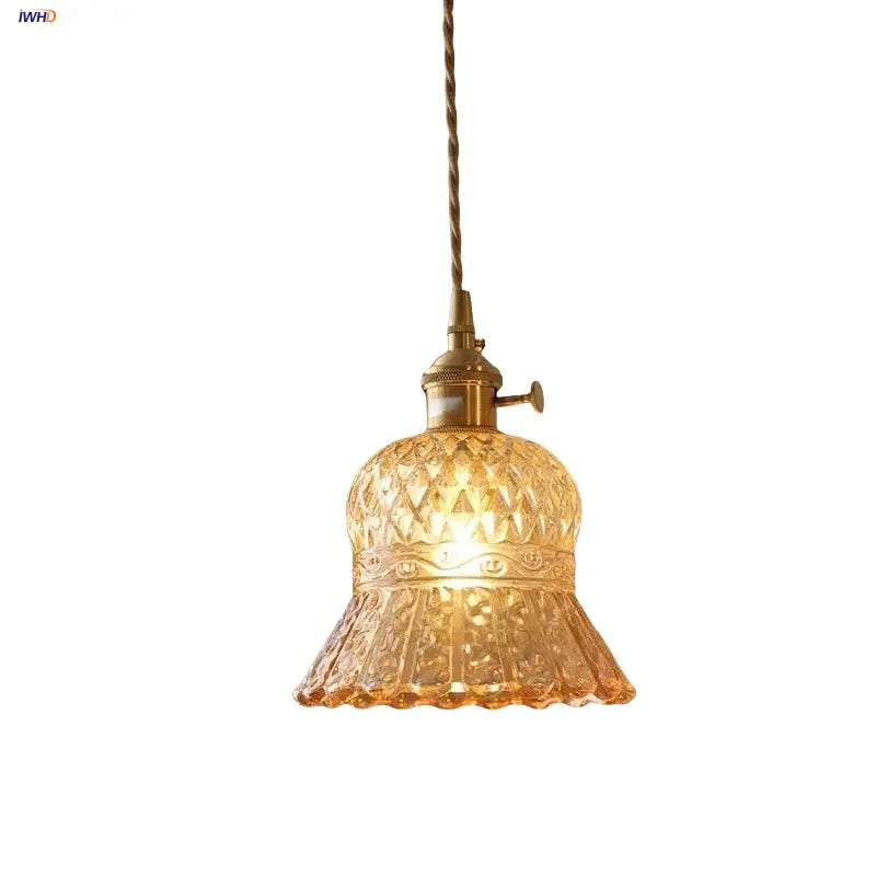 Decorbites amber glass led pendant light with warm amber diamond-cut floral patterns and twisted brass cord suspension