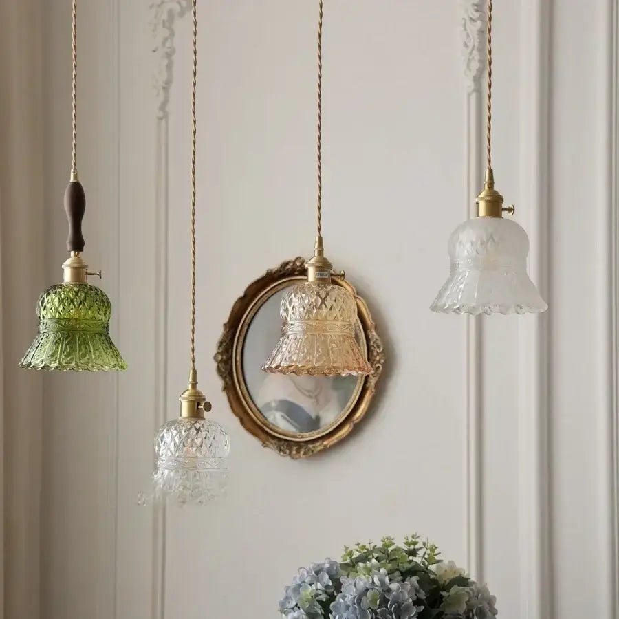 Three vintage-style bell-shaped pendant lights with textured green, clear, and frosted glass shades by DecorBites amber glass led