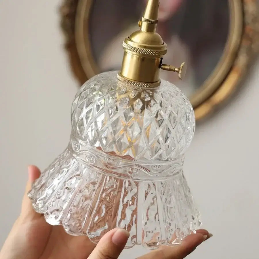 Clear cut decorbites amber glass led pendant light with brass socket and intricate diamond-cut patterns in amber glass