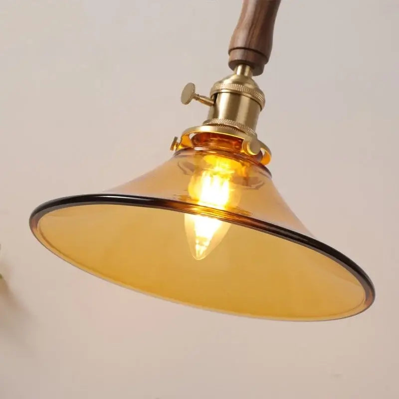 DecorBites amber glass led pendant light with warm amber glass, brass fixture, and walnut handle for dining and living rooms