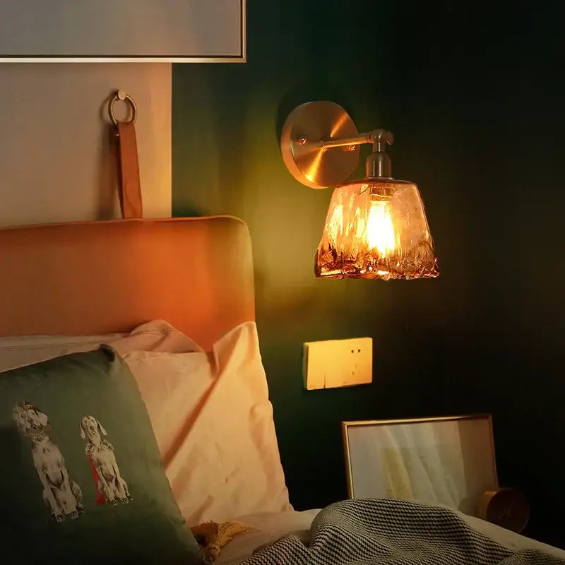DecorBites amber glass led wall lamp with warm-toned brass and textured amber shade for minimalistic bedroom lighting