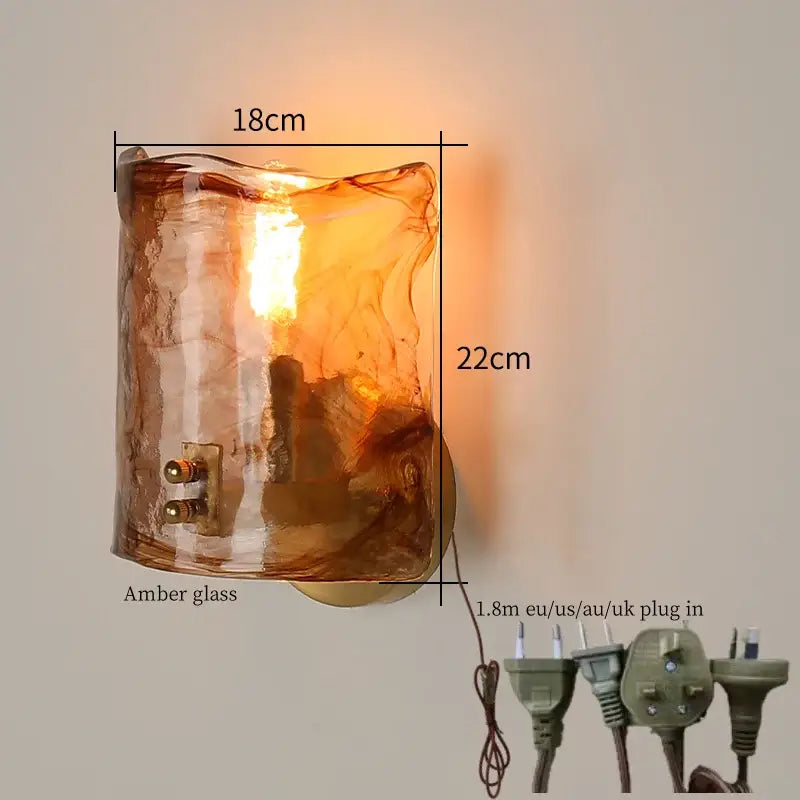Decorbites amber glass led wall lamp with textured hand-blown design emitting warm glow for bedroom lighting