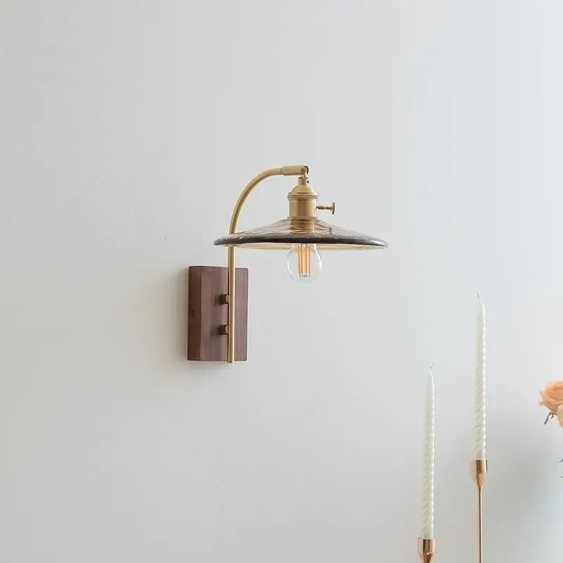 Brass wall lamp with dark translucent shade and exposed filament bulb decorbites amber glass led Nordic style