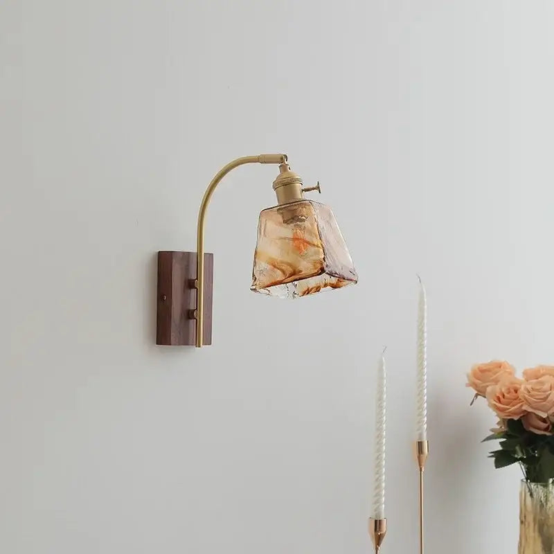 Brass-finished decorbites amber glass led wall lamp with rectangular amber glass shade and swirling golden patterns