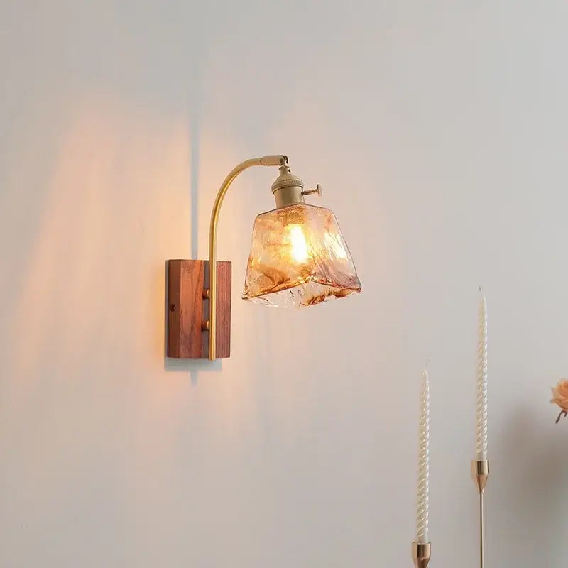 DecorBites amber glass led wall lamp with warm amber glass, brass finished arm, and wooden base for modern decor