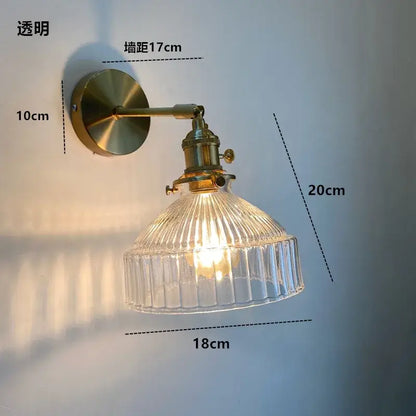 Brass-finished wall light fixture with clear ribbed amber glass shade and on/off switch Nordic modern design