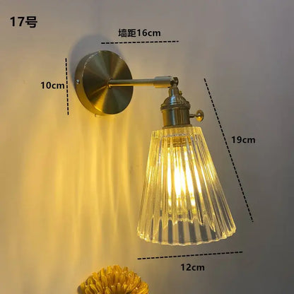 DecorBites amber glass LED wall light fixture with brass metal arm and fluted clear glass shade for warm lighting