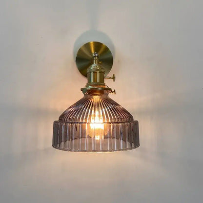 Decorbites amber glass wall light fixture with warm ribbed smoked glass and brass finished mount with mechanical switch
