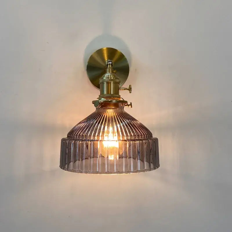 Decorbites amber glass wall light fixture with warm ribbed smoked glass and brass finished mount with mechanical switch