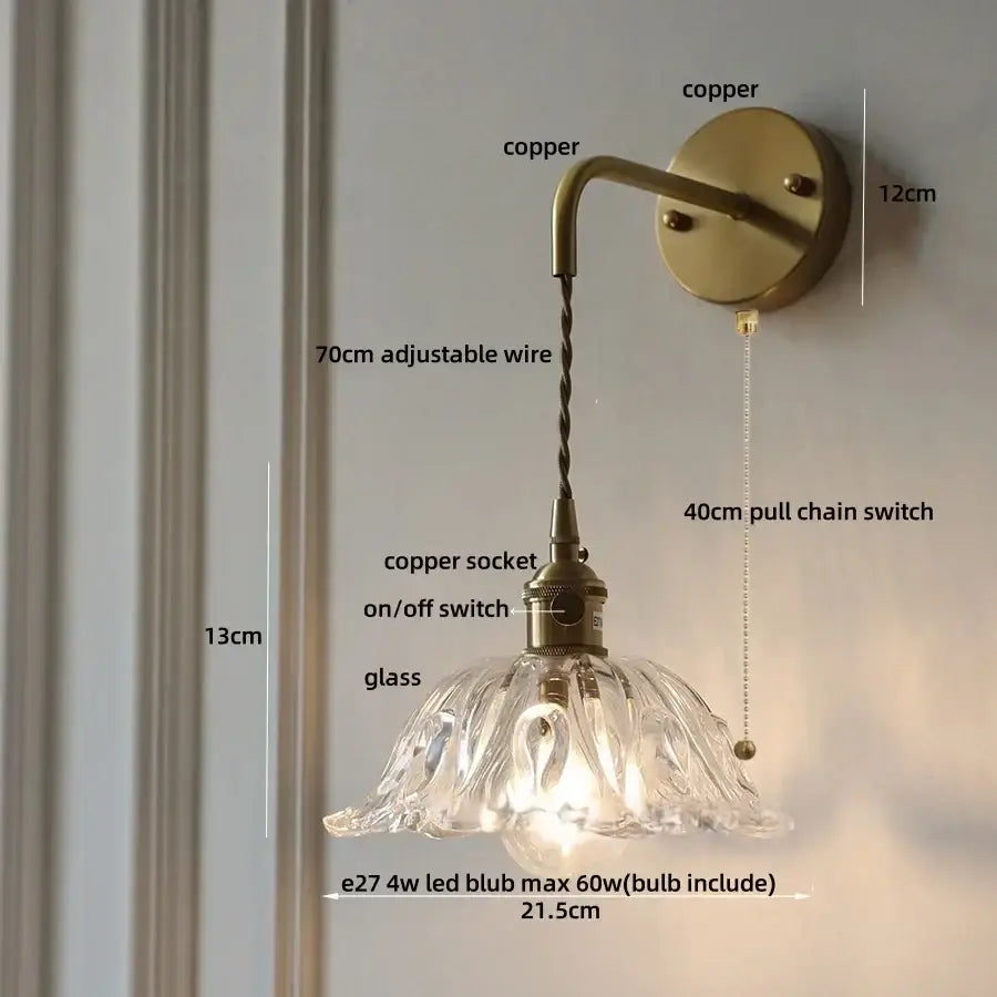 Antique brass-finished copper wall sconce with clear petal-shaped amber glass led shade and adjustable 70cm wire decorbites amber glass