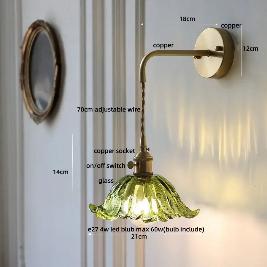 Vintage-style copper wall sconce with green petal-shaped glass shade featured in DecorBites amber glass led collection
