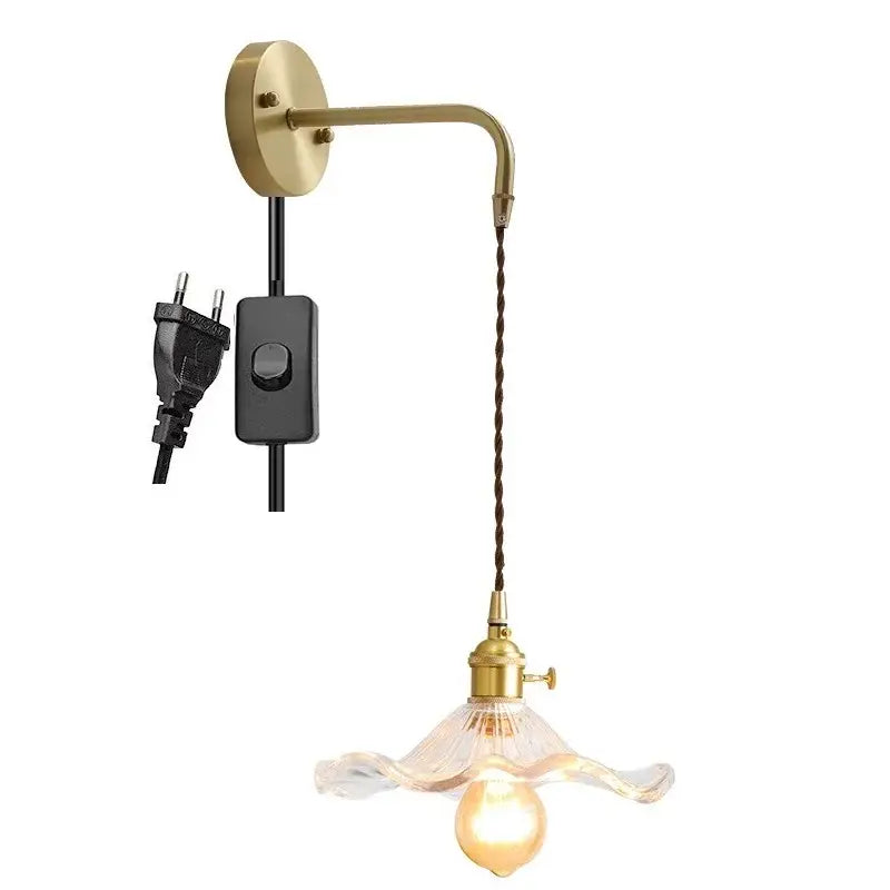 Decorbites amber glass wall sconce with brass mount, twisted cord, and clear fluted glass shade for indoor lighting