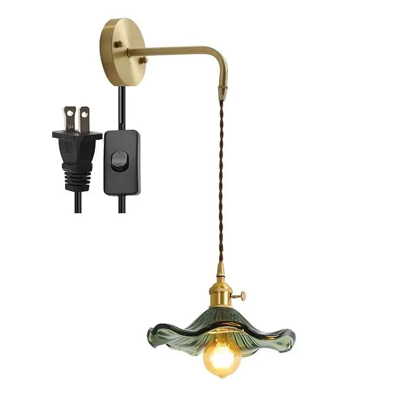 Vintage-style decorbites amber glass wall sconce with brass arm and green ruffled glass shade for indoor lighting