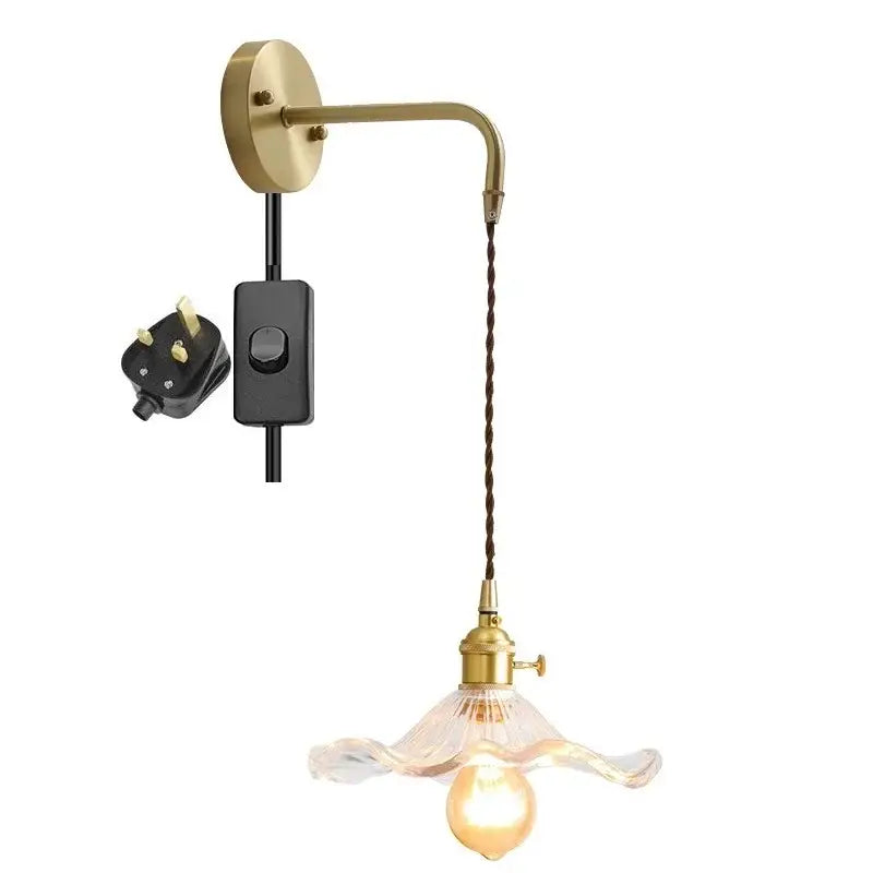 Vintage-style brass wall sconce with twisted brown cord and amber glass shade by decorbites for indoor lighting
