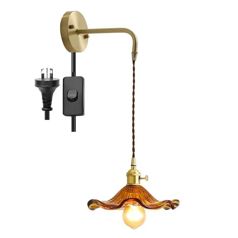 Brass-finished DecorBites amber glass wall sconce with twisted brown cord and amber glass shade for indoor lighting