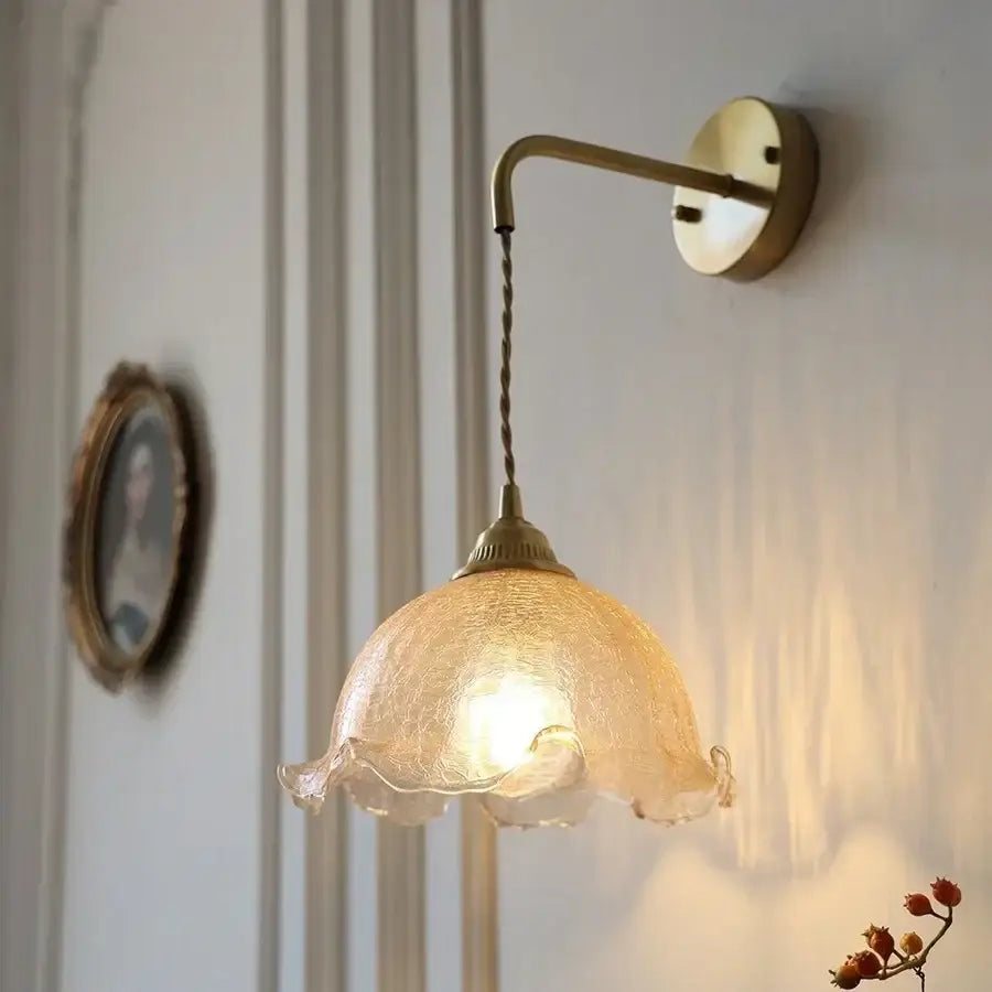 DecorBites amber glass LED wall sconce with warm-toned textured ruffled shade and brass metal arm for bedroom and bathroom