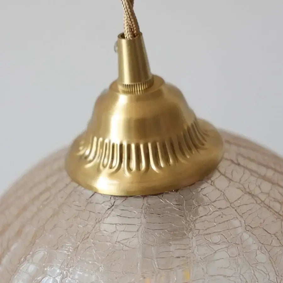 Gold-toned brass wall sconce with decorbites amber glass textured crackled globe and amber glass led light for bedroom and bathroom