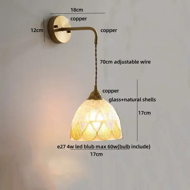A warm-toned copper DecorBites amber glass led wall sconce with decorative glass and natural shell shade for bedroom and bathroom