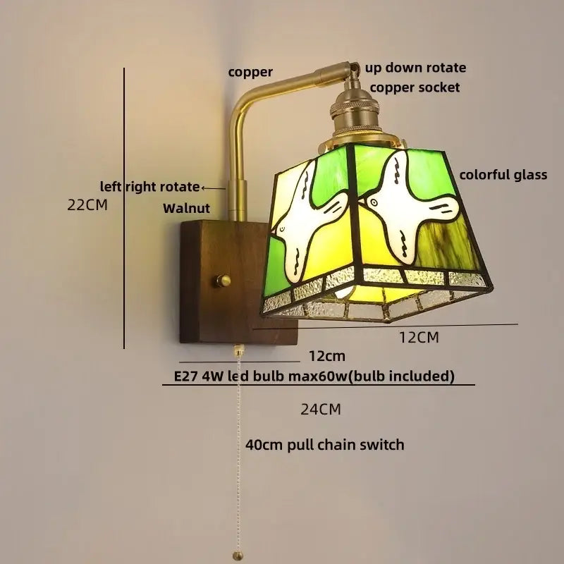 Vintage-style decorbites amber glass wall sconce with brass arm and walnut wood base featuring stained glass panels