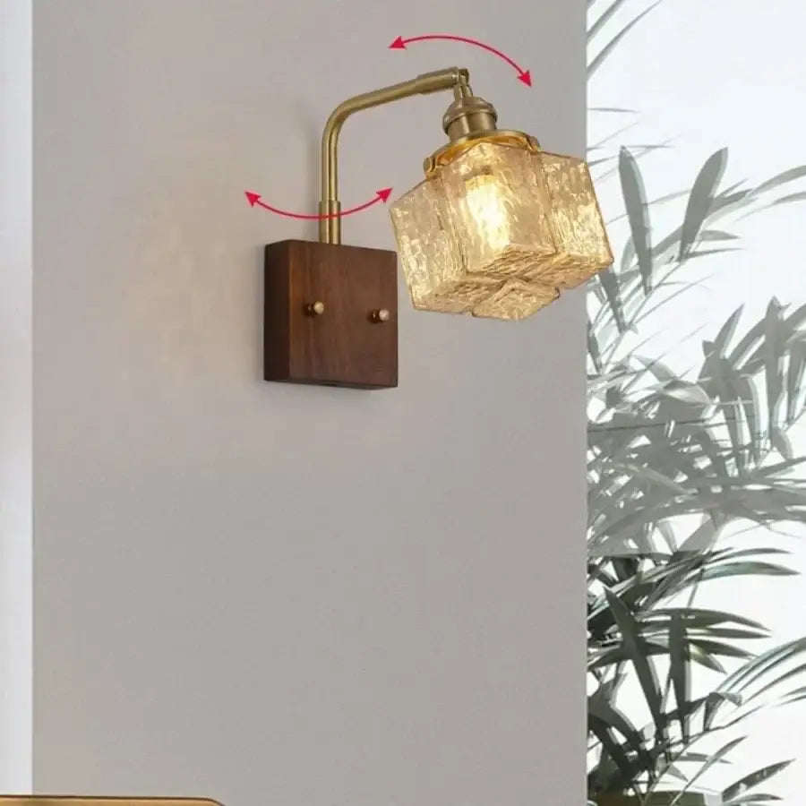 Decorbites amber glass led wall sconce with brass finish, textured amber glass shade, and walnut wood base for living room