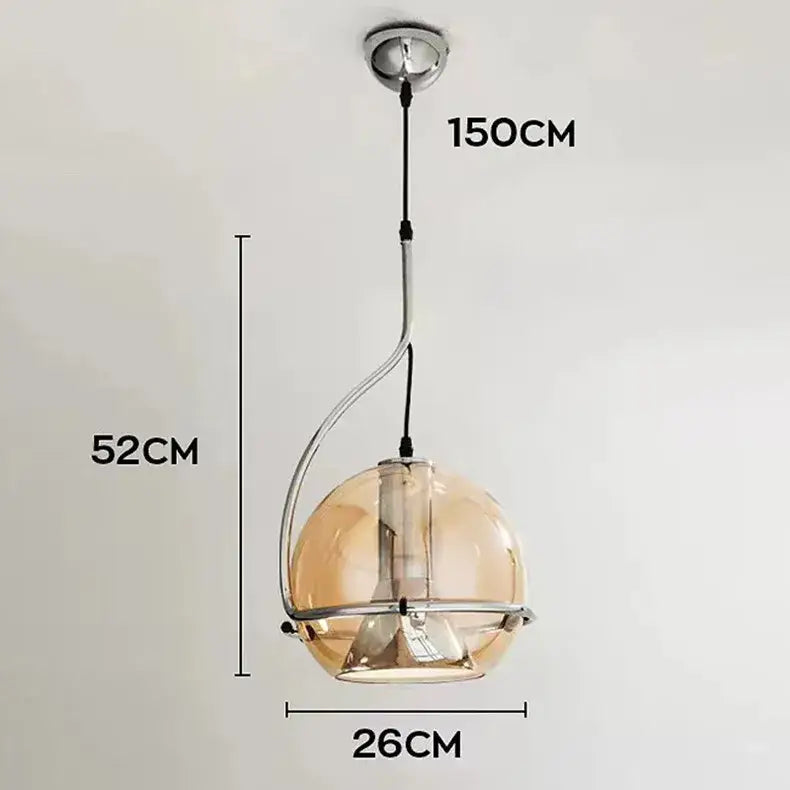 A sleek modern pendant light with curved chrome frame and amber glass globe from decorbites amber glass pendant series