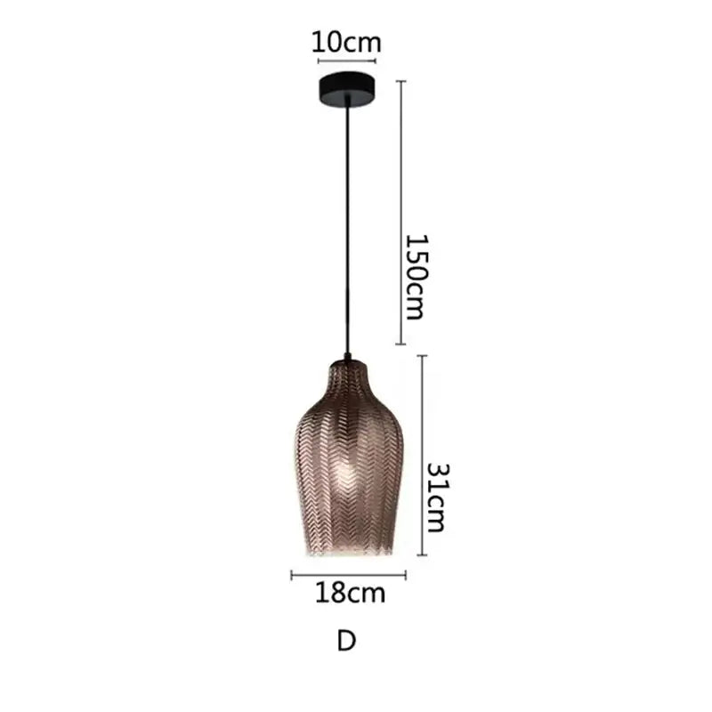 A decorbites amber glass pendant light with copper textured chevron shade suspended by black cord for modern spaces