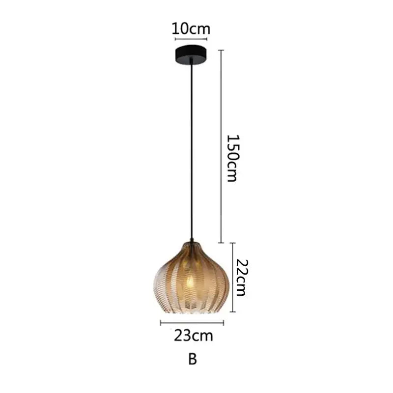 A modern decorbites amber glass pendant light with black mount and amber ridged glass shade for kitchen or bedroom