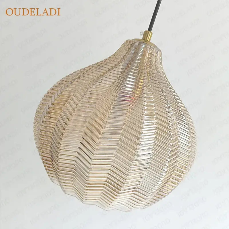 Pear-shaped decorbites amber glass pendant light with textured chevron pattern and brass top for kitchen and bedroom