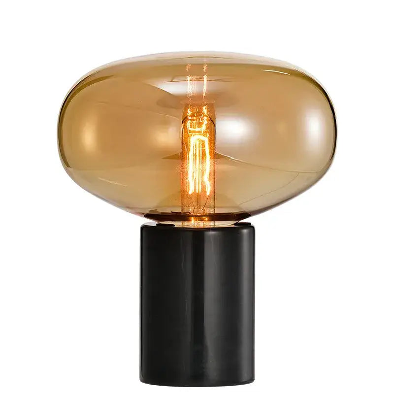 Decorbites amber glass sleek amber glass table lamp with black base and exposed filament bulb for modern living spaces
