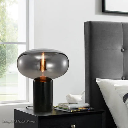 DecorBites amber glass table lamp with sleek black base and smoked glass dome for modern living spaces