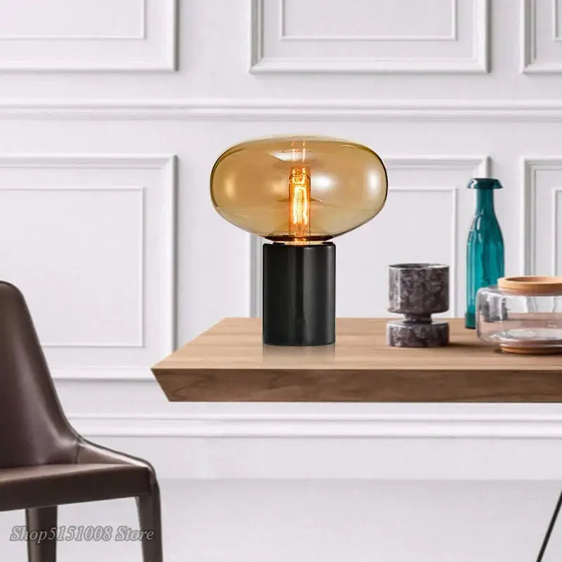 Decorbites amber glass table lamp with sleek amber glass shade and black base for modern living spaces