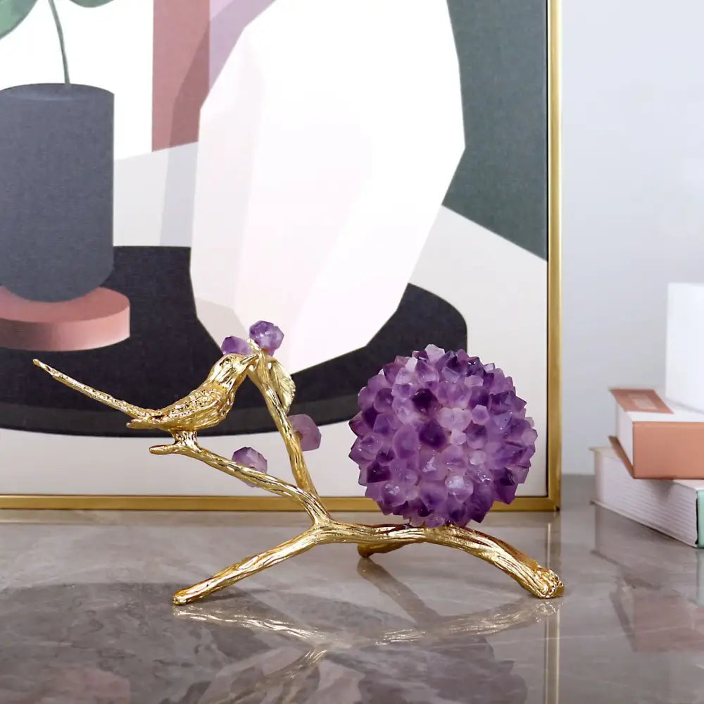 Golden flower ball bird sculpture perched on branch with purple amethyst flower ball base for desk decoration