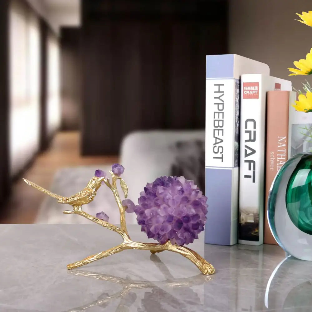 DecorBites™ amethyst flower ball bird sculpture features a gold-toned branch with vibrant purple amethyst crystals