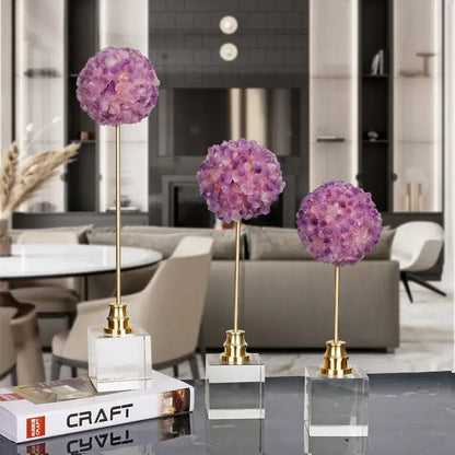 Three elegant purple amethyst flower metal sculptures with crystal hydrangea design on gold stems and clear acrylic bases