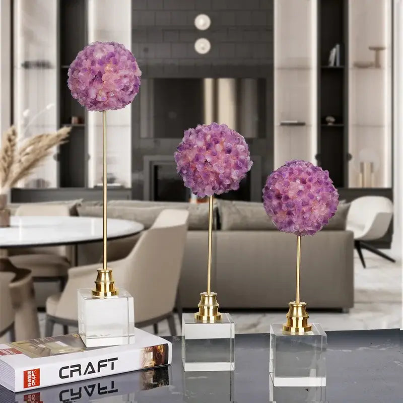 Three elegant purple amethyst flower metal sculptures with crystal hydrangea design on gold stems and clear acrylic bases
