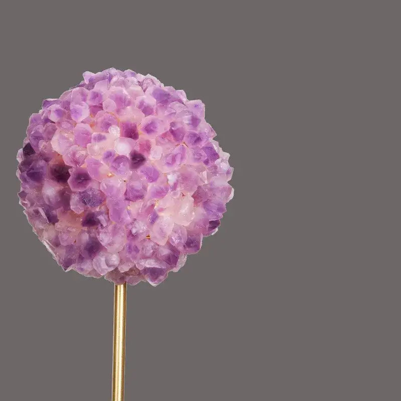Decorbites amethyst flower metal sculpture featuring a spherical gradient purple amethyst flower on a gold-toned stick
