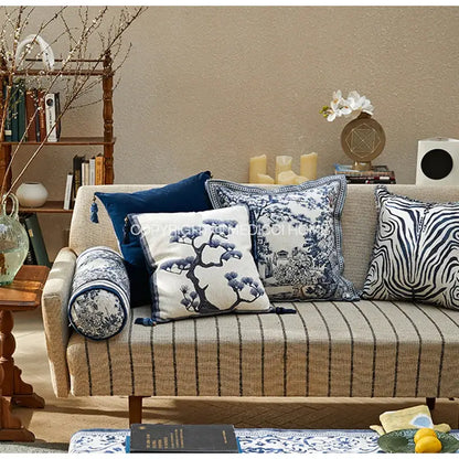 Beige striped sofa with DecorBites™ ancient indigo jungle cushion covers featuring hand-painted indigo jungle decorative patterns