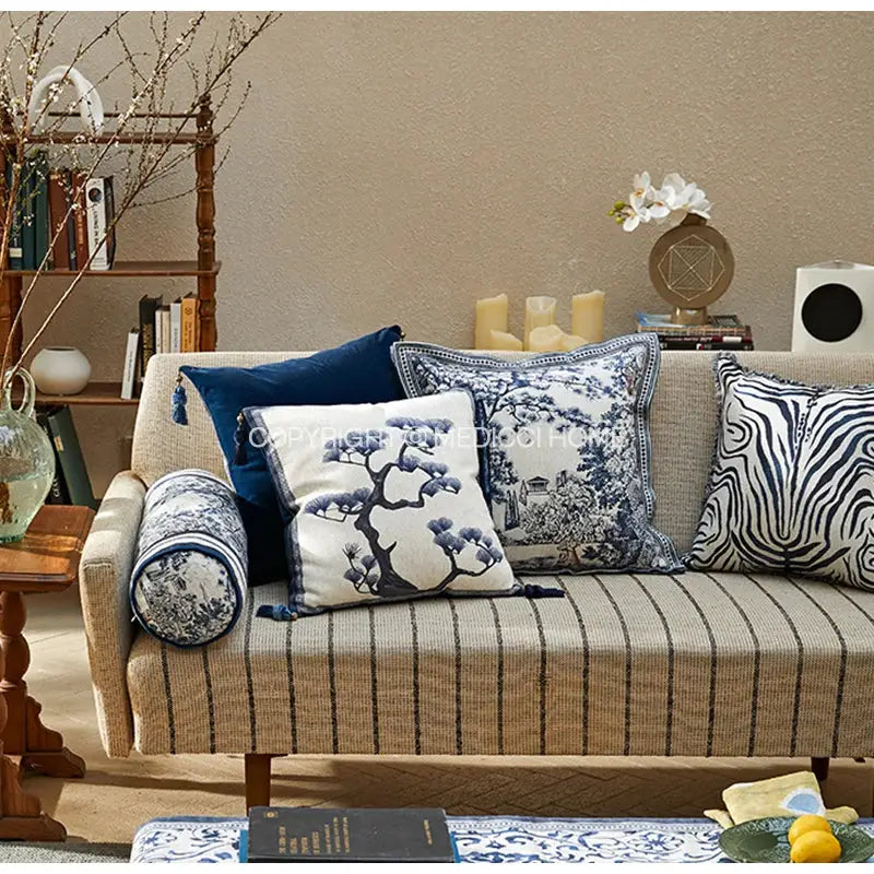 Beige striped sofa with DecorBites™ ancient indigo jungle cushion covers featuring hand-painted indigo jungle decorative patterns