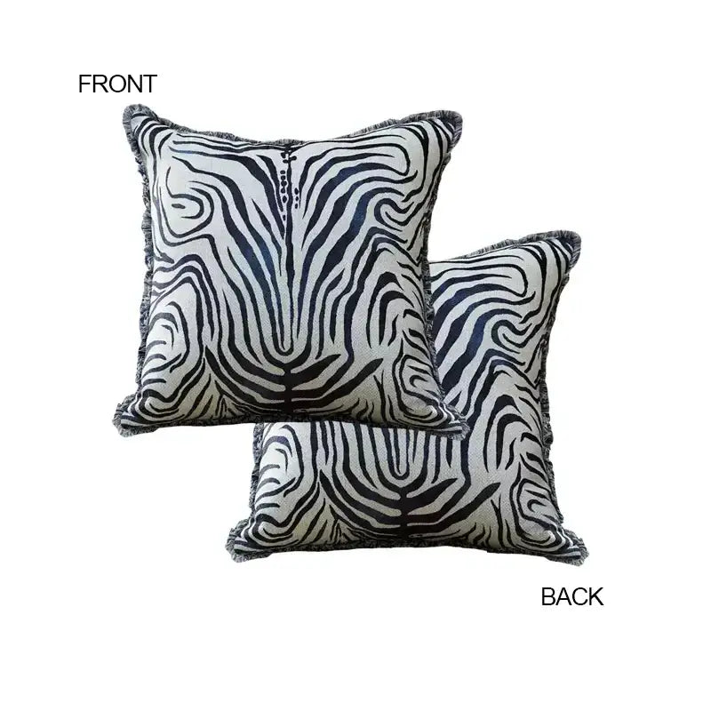 Square cushion covers with bold black and white zebra stripes and frayed edges from DecorBites™ ancient indigo jungle collection
