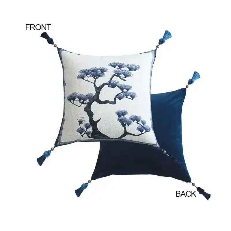 Square cream cushion cover with embroidered blue pine tree and navy tassels from decorbites ancient indigo jungle collection