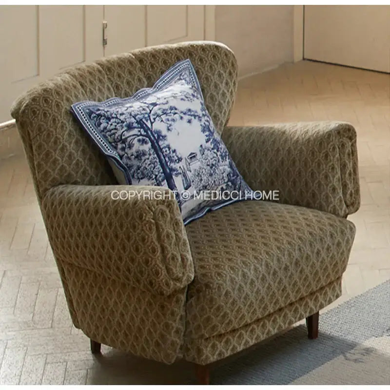 Beige upholstered armchair with wooden legs featuring decorbites™ ancient indigo jungle indigo jungle decorative cushion covers