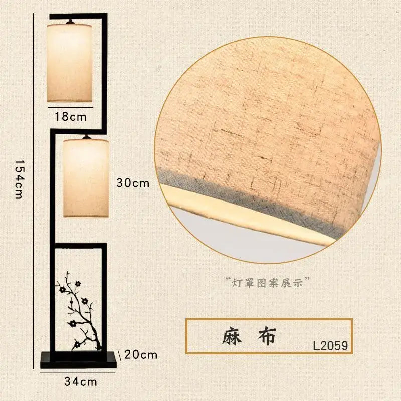 Black-framed floor lamp with two beige fabric shades and decorative ancient plum branch motif in chinese style
