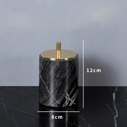 Black marble cylindrical container with gold-toned lid and knob from DecorBites™ ancient wood grain bathroom set