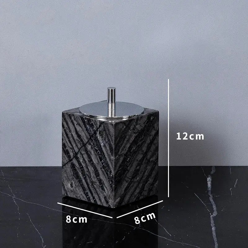 Black marble cube-shaped toilet paper holder with polished chrome lid and rod from DecorBites ancient wood grain set