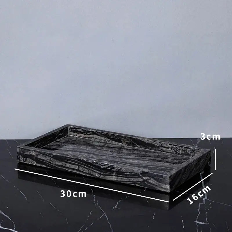 Black marble serving tray with sleek polished surface and natural veining from decorbites ancient wood grain set