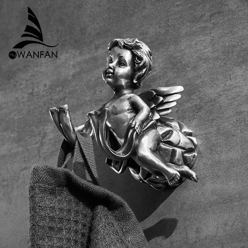 DecorBites™ angel brass towel hook in silver tone with detailed wings and draped fabric for wall-mounted towel storage