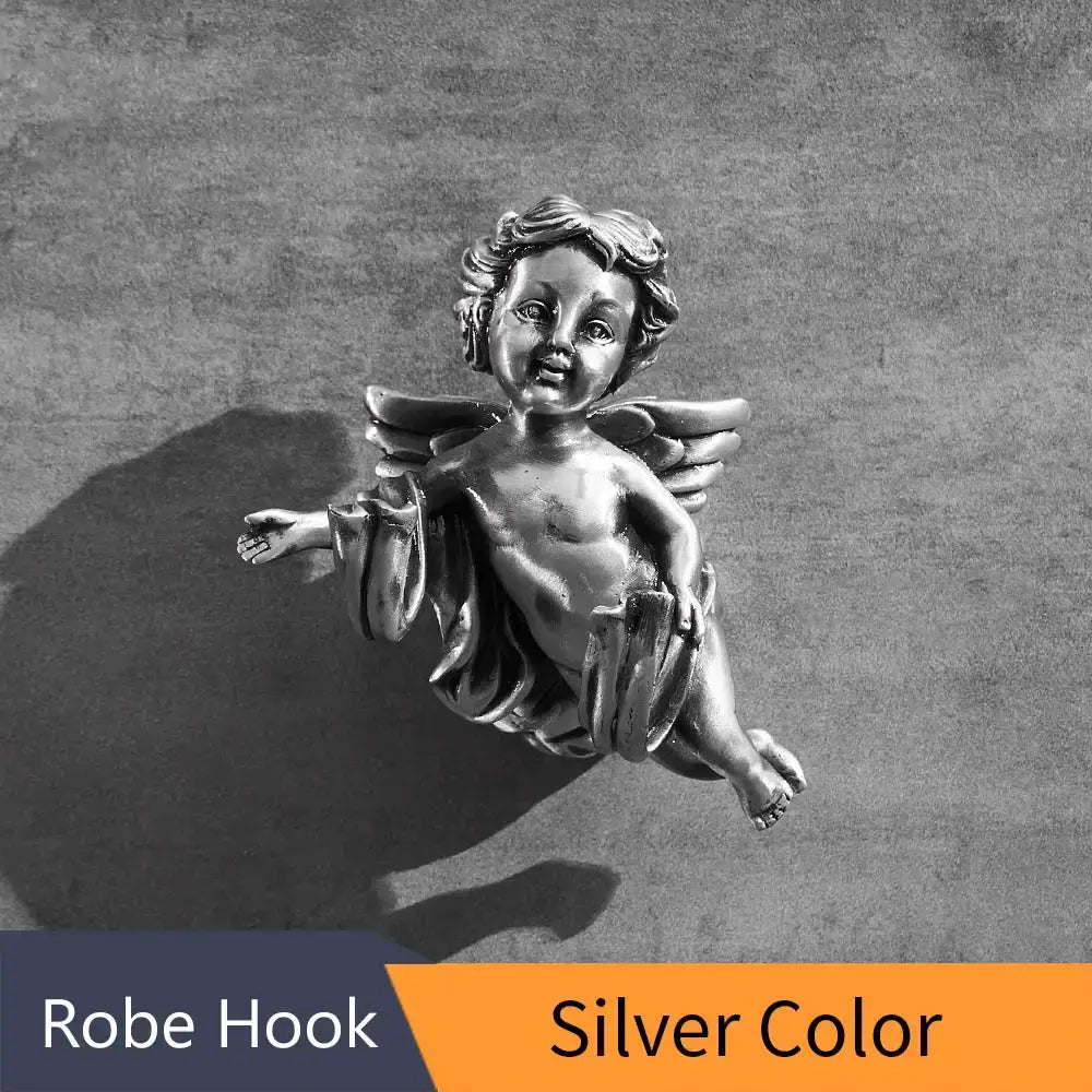 Silver-colored metallic decorbites™ angel brass towel hook shaped like cherub for bathroom and garage wall mounted use